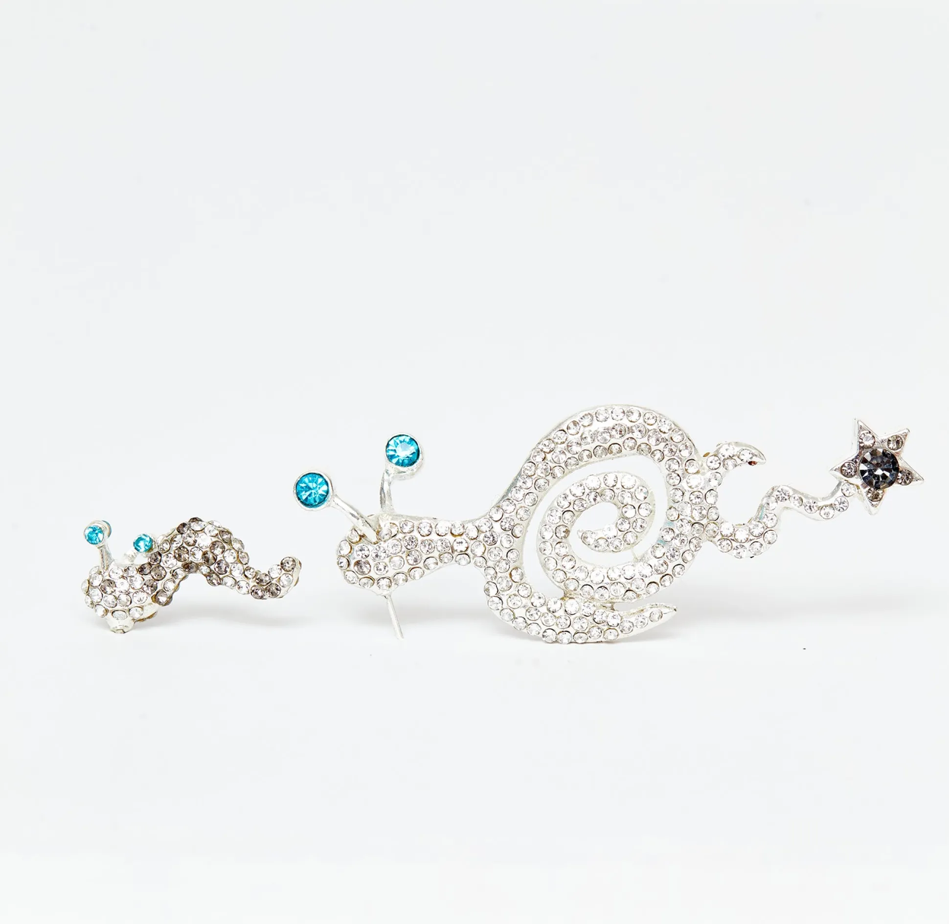 rhinestone_tattoo_snail_earring_light_blue_0.webp Earrings | Collina Strada RHINESTONE TATTOO SNAIL EARRING LIGHT BLUE